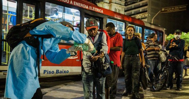 In Brazil, a group of cyclists distribute personal hygiene kits to people living on the street