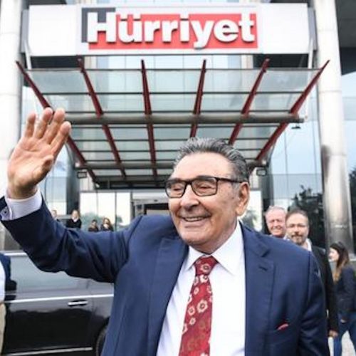 The person who was Turkey's biggest media owner, Aydın Dogan, leaves daily Hurriyet headquarters in Istanbul after bidding farewell to staff following selling his entire media group in a surprising move.